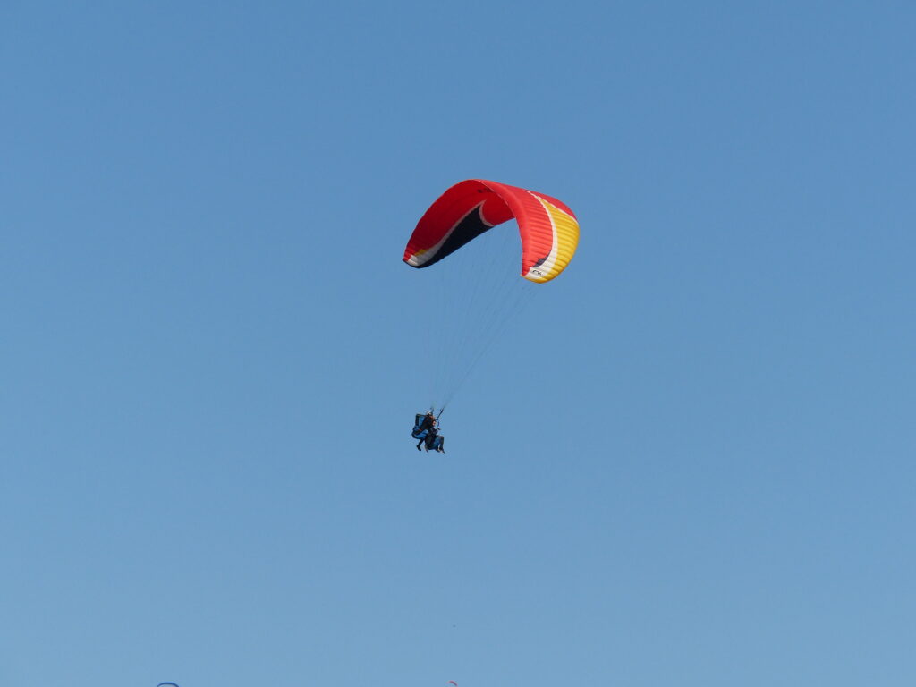 Paragliding adventure, soaring above scenic landscapes and enjoying panoramic views.