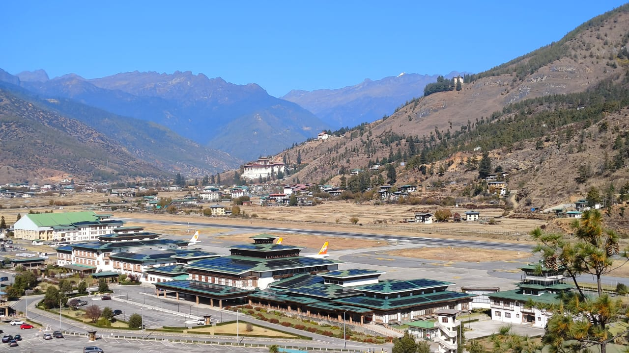 Paro International Airport surrounded by Himalayan mountains, gateway to Bhutan Tour 3 Nights 4 Days.
