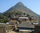 Ethnic Magar village with traditional houses and lush greenery, reflecting the authentic lifestyle of the community.