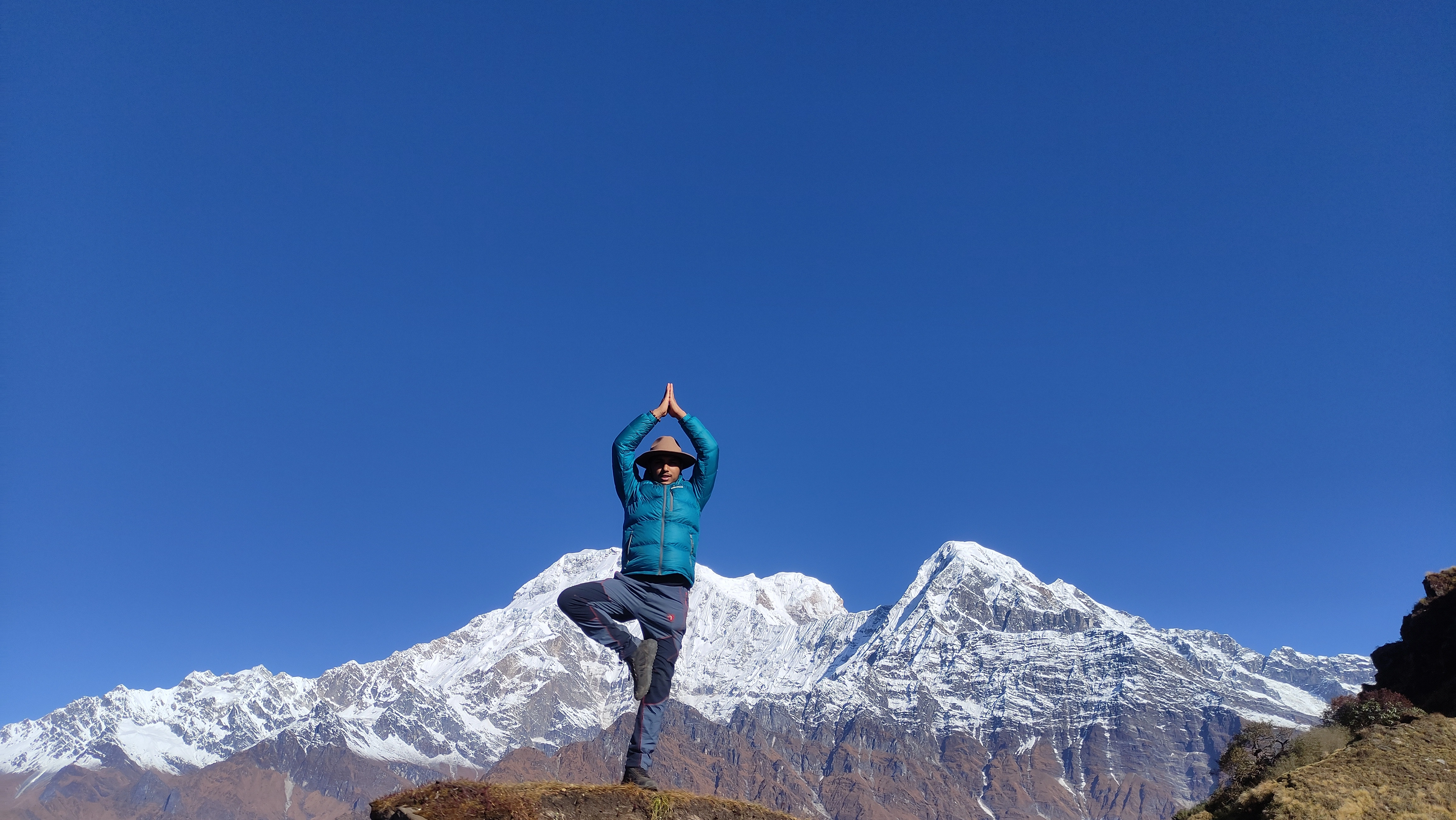 MR. Rajan doing Surya Namaskar infront of Annapurna.