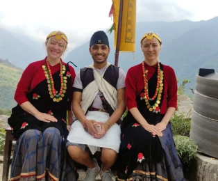 Our clients wearing traditional Gurung dress during theshort annapurna Base Camp Trek in Nepal.