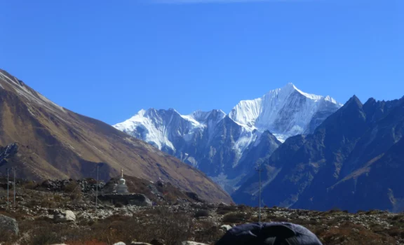 Wide-angle view of Langtang Valley surrounded by dramatic Himalayan peaks.