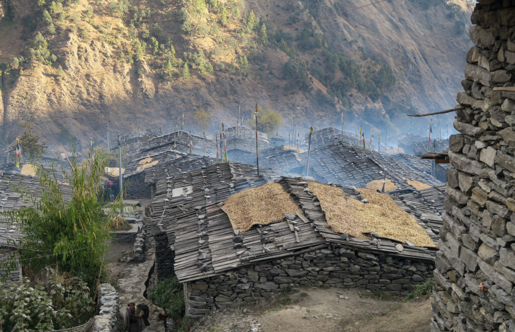Traditional Tamang house made of wood and stone, reflecting cultural architecture in Nepal.