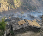 Traditional Tamang house made of wood and stone, reflecting cultural architecture in Nepal.