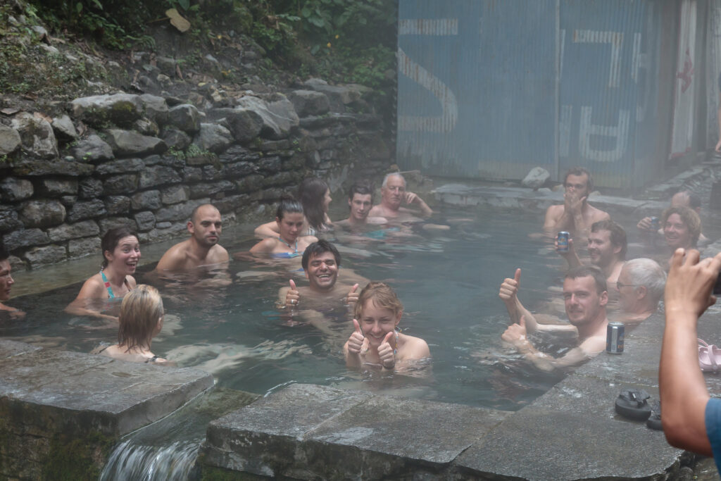 Trekkers recovering their weary muscles in the natural hot springs at Jhinu Danda.