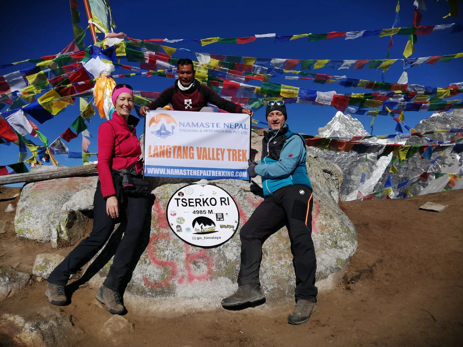 Namaste Nepal Team celebrating at the top of Tserko Ri.
