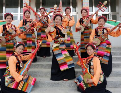Tibetan beauty queens wearing traditional cultural dress and holding musical instruments