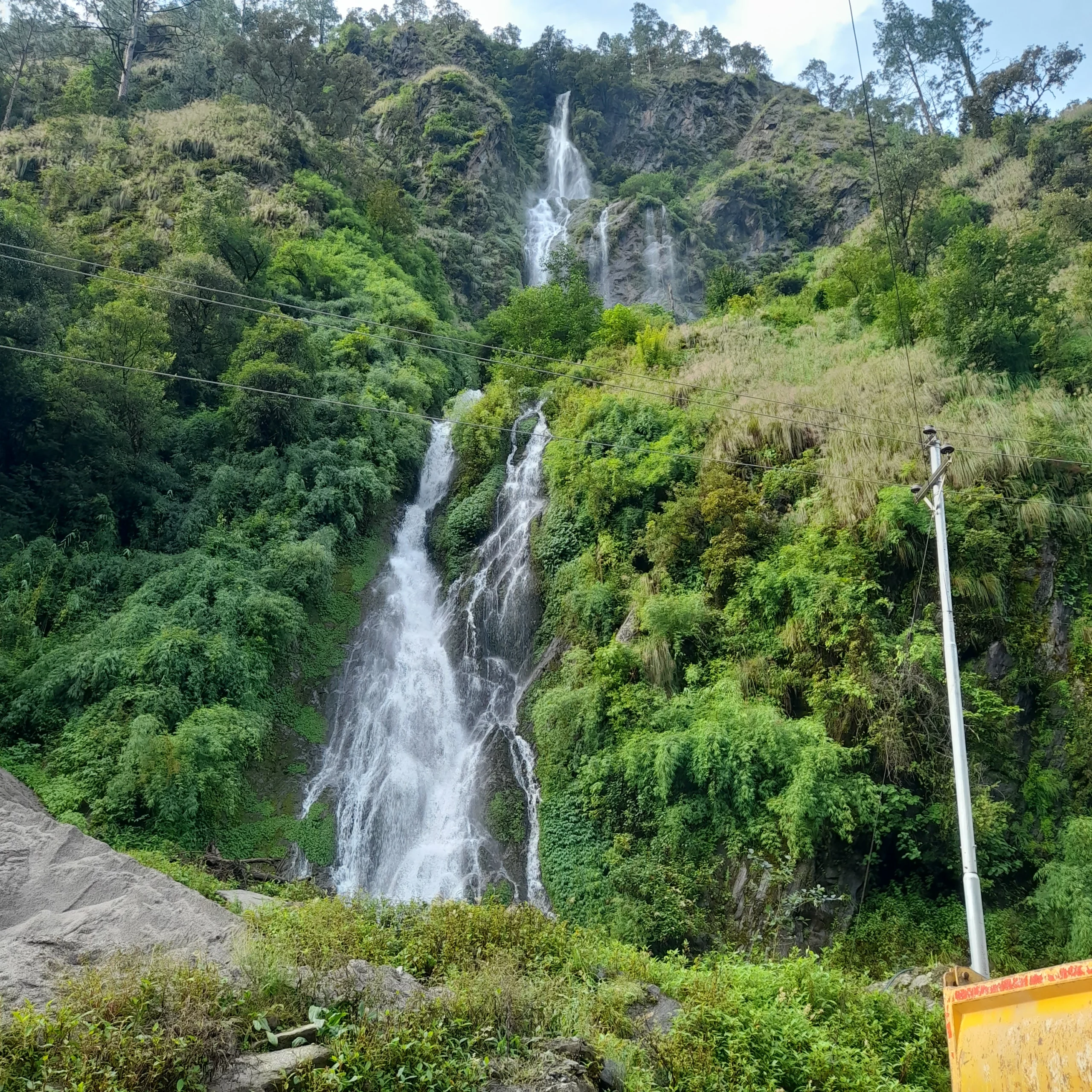Scenic waterfall along the Langtang Valley Trek trail.