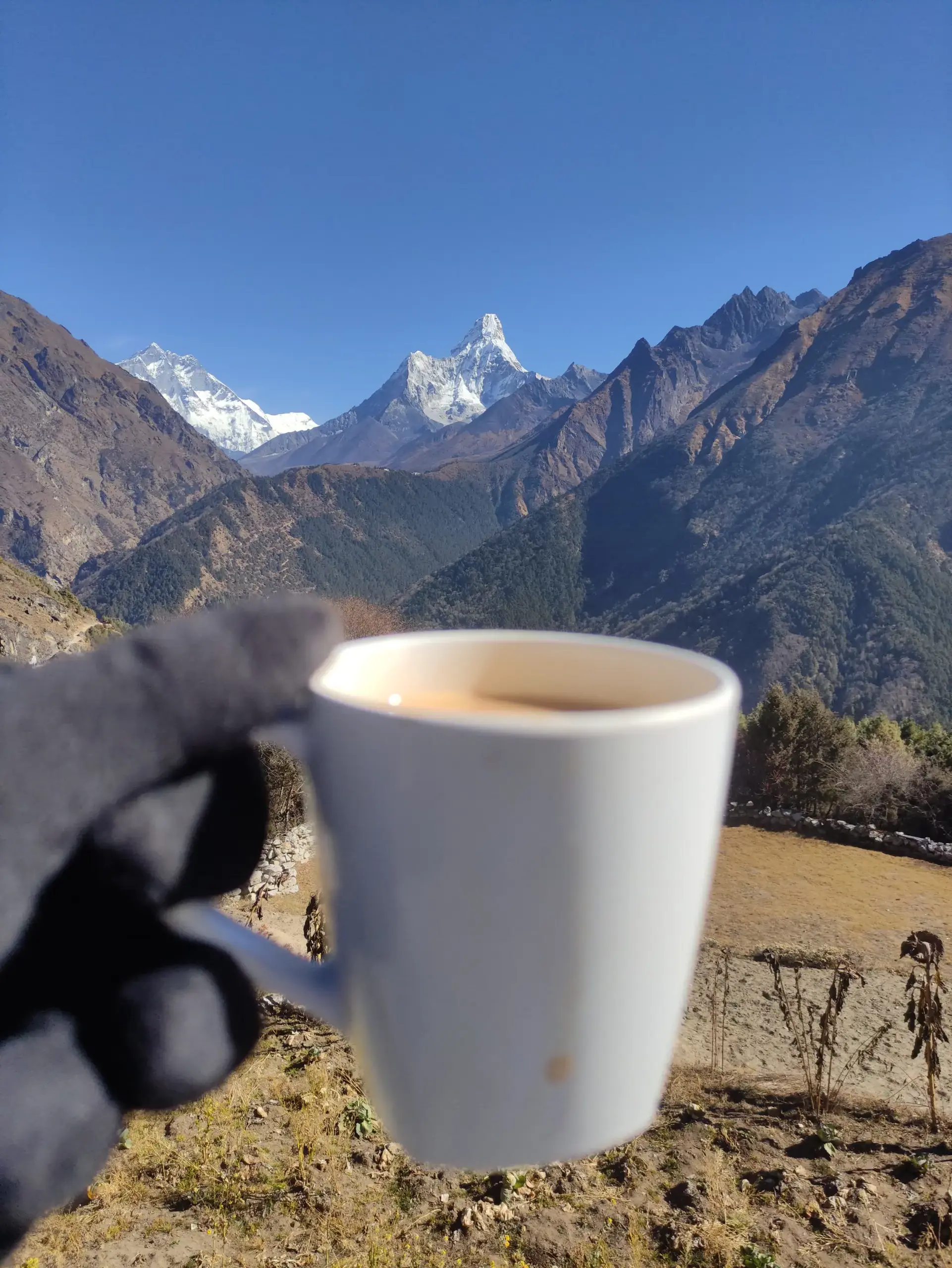 Tea break with views of Mount Everest and Ama Dablam while trekking to Tengboche Monastery.