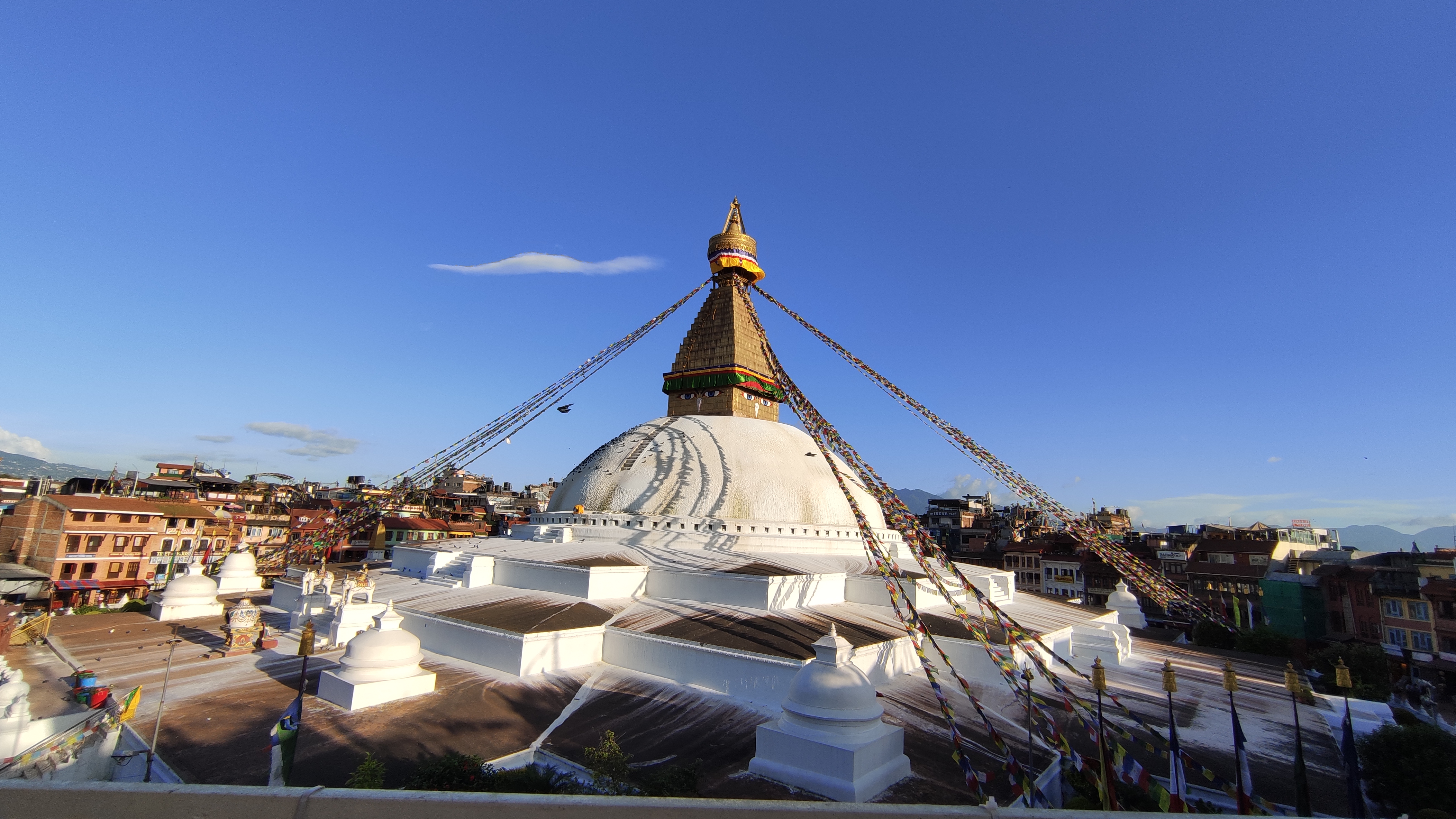 Iconic Boudhanath Stupa in Kathmandu, Nepal, adorned with prayer flags and symbolizing peace and spirituality.