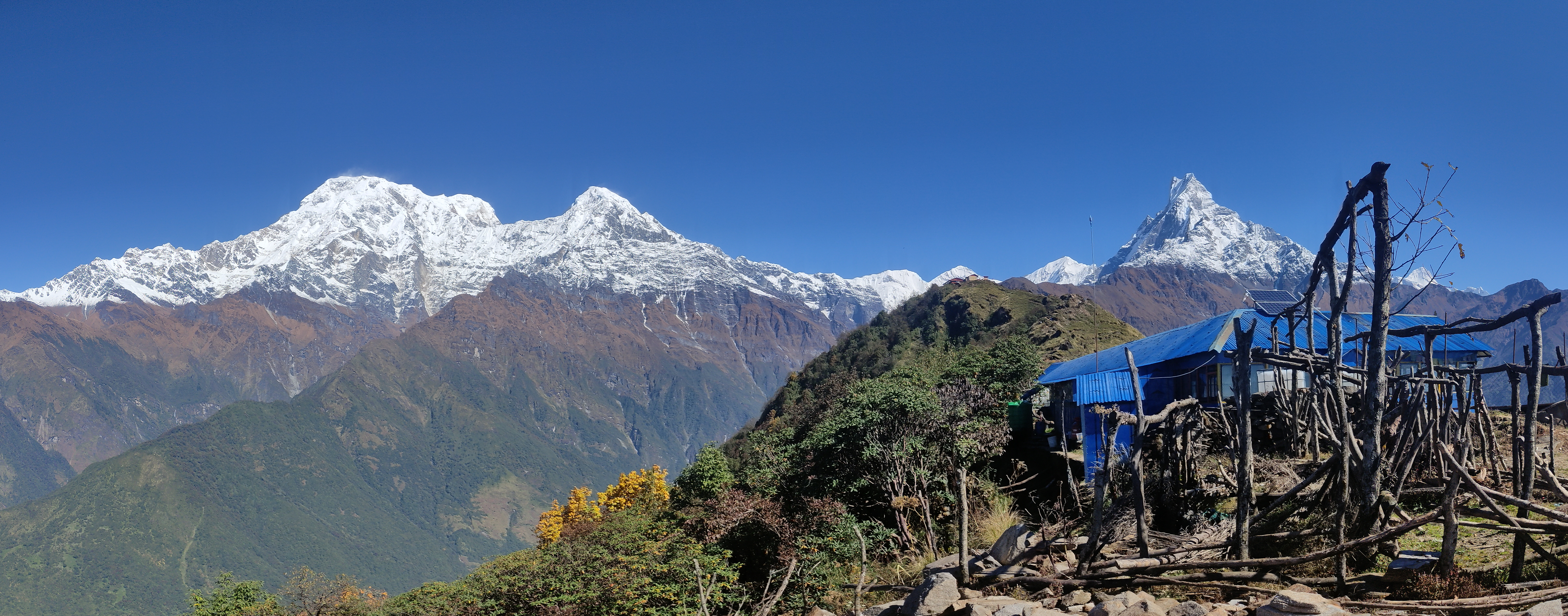 Panoramic view of the Annapurna Himalayan range, capturing its towering peaks and serene valleys.