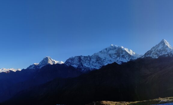 Panoramic view of the Annapurna and Dhaulagiri mountain ranges. showcasing Nepal's Himalayan beauty.