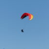Paragliding adventure, soaring above scenic landscapes and enjoying panoramic views.
