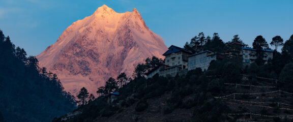 Sunset view of Mt. Manaslu during the Tsum Valley and Ganesh Himal Base Camp Trek, capturing the mountain's majestic glow.