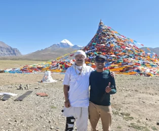 Mount Kailash view and pilgrims from Darchen.
