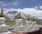 Sacred Mount Kailash surrounded by Buddhist stupas and snow-covered Himalayan peaks during Kailash Yatra 2026