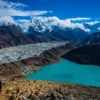 Breathtaking view of Gokyo Lake and Gokyo Valley from Gokyo Ri, showcasing the stunning turquoise waters and surrounding Himalayan peaks.