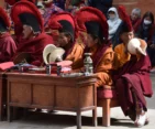 Monks chanting prayers and performing rituals on the second day of Tiji Festival in Upper Mustang.