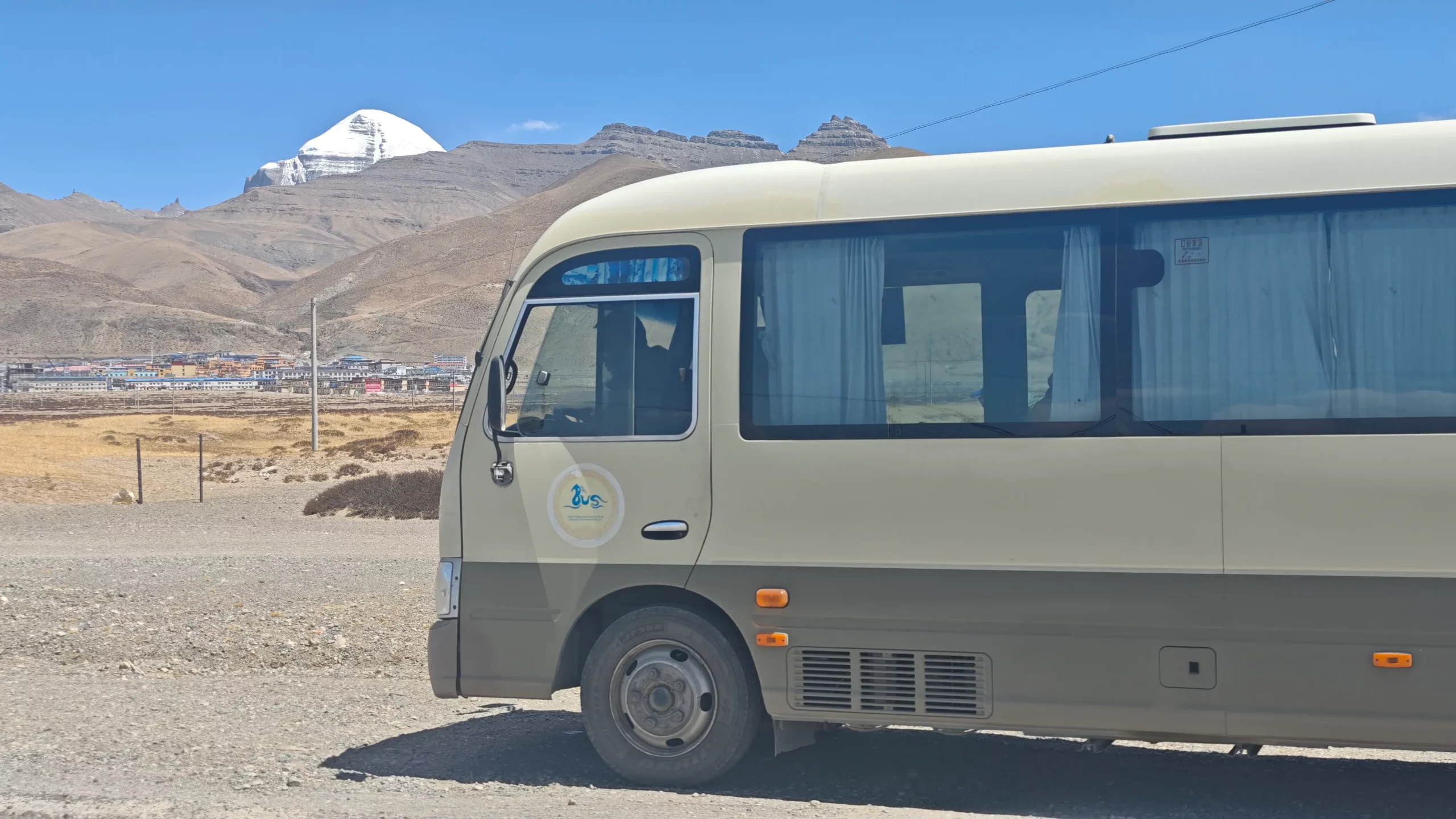 Comfortable Bus at Darchen with Mount Kailash view – part of Kailash Manasarovar Tour with EBC and Lhasa.