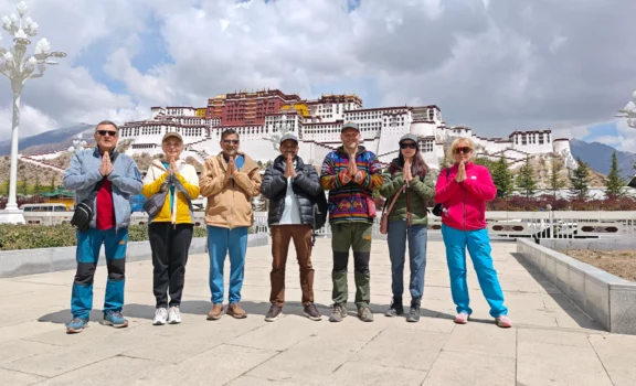 Potala Palace with our team – Group standing proudly in front of the grand Potala Palace.