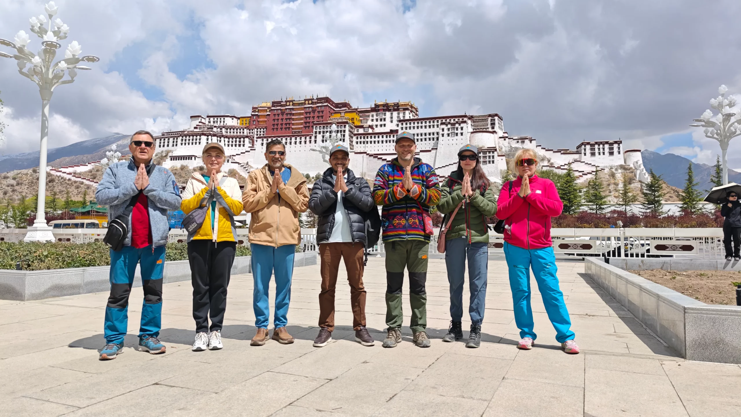 Potala Palace with our team – Group standing proudly in front of the grand Potala Palace.