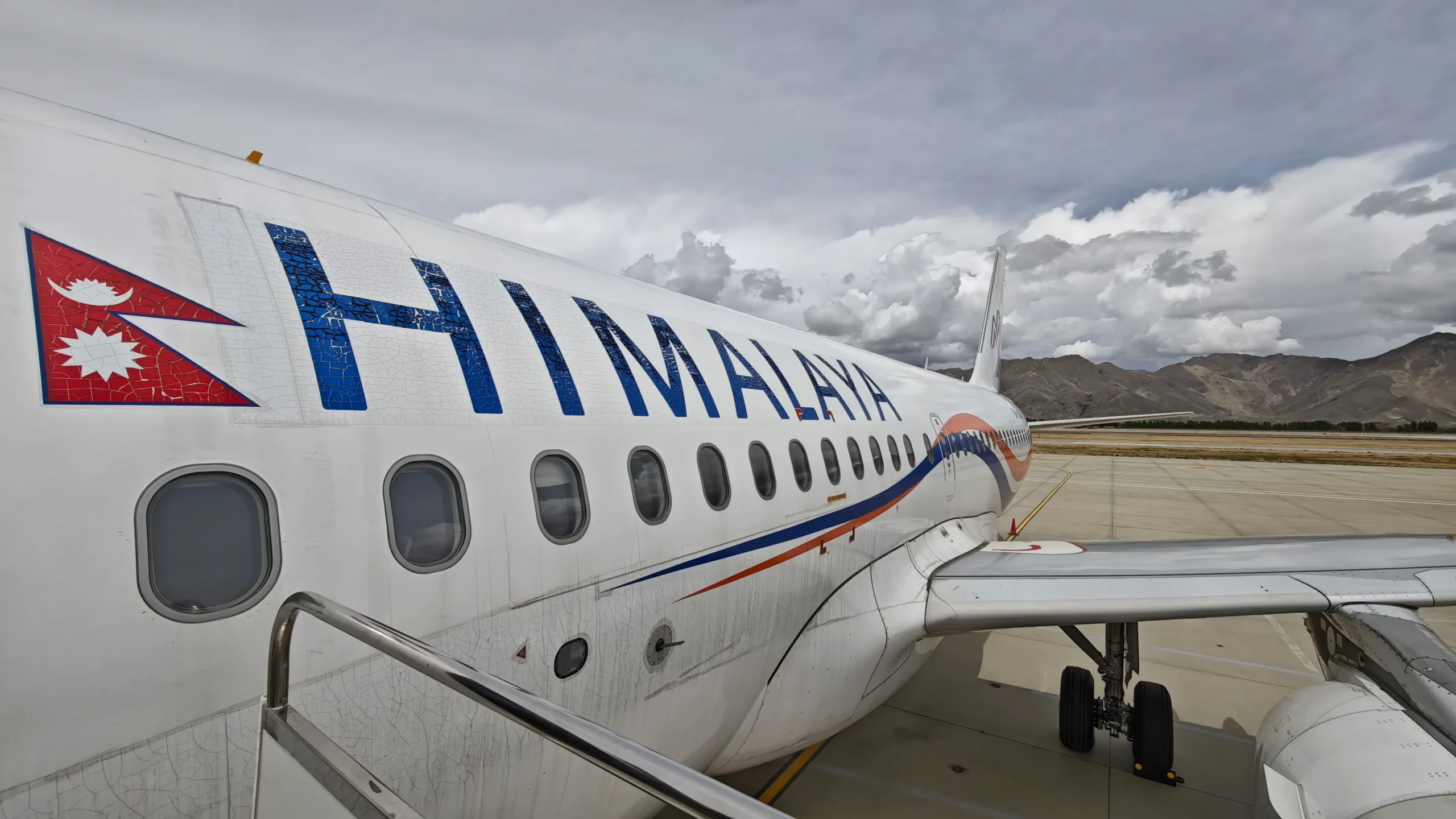 Airplane on the runway preparing for flight from Lhasa to Kathmandu.