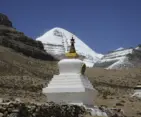 Recent 2026 view of sacred Mount Kailash with Buddhist stupa and snow-covered Himalayan landscape in Tibet