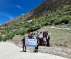 Pilgrims and travelers visiting the sacred Drak Yerpa Cave complex near Lhasa during the Kailash Manasarovar Yatra with Everest Base Camp and Lhasa tour.