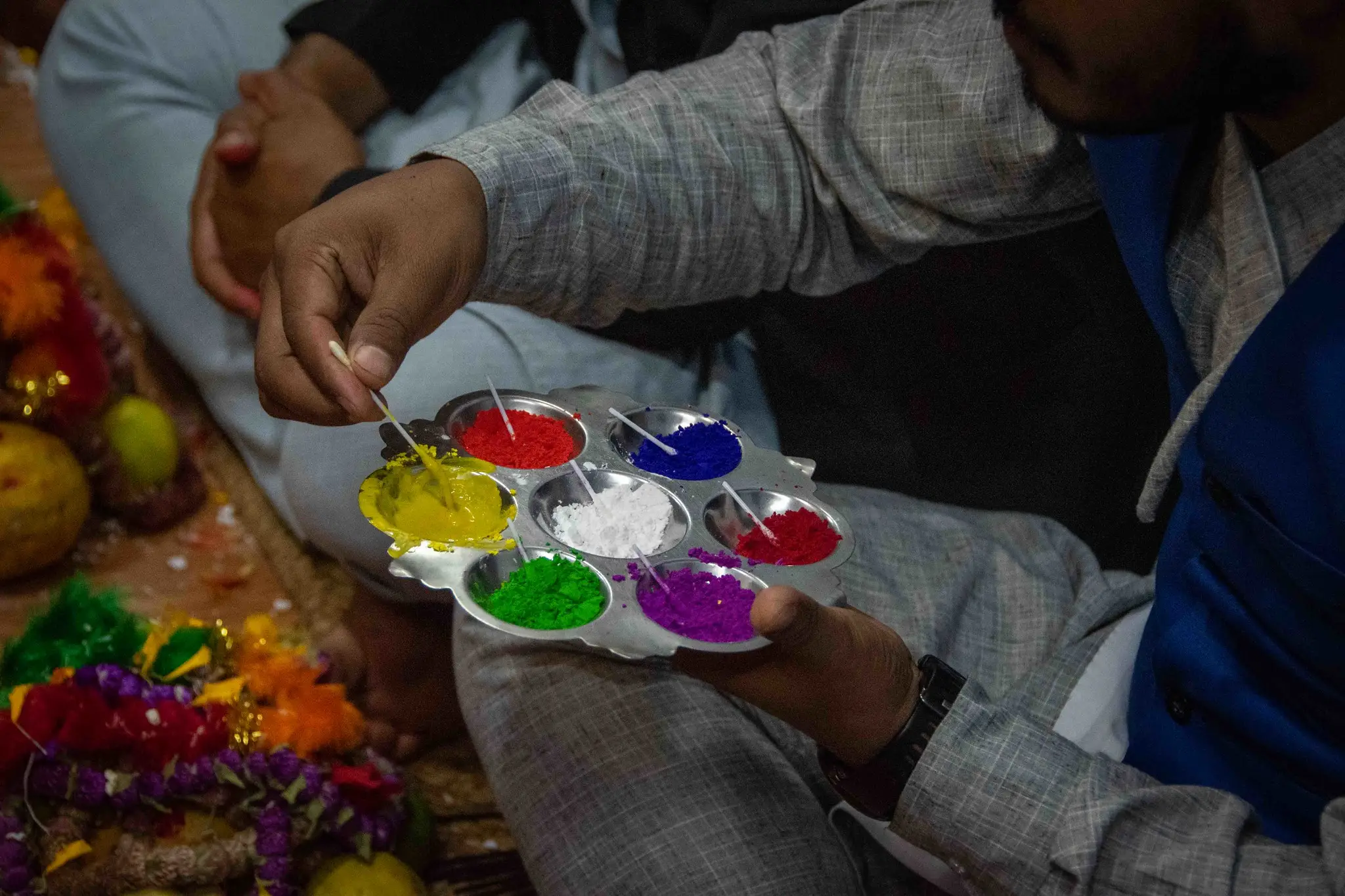 Preparing Saptarangi Tika (seven Colours) during Bhai Tika on Tihar Festival.