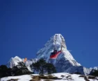 Helicopter flying towards Everest Base Camp, offering a thrilling aerial view of the Himalayas.