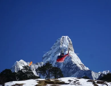 Helicopter flying towards Everest Base Camp, offering a thrilling aerial view of the Himalayas.