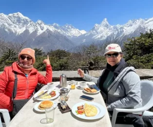Clients enjoying breakfast with a stunning view at Everest View Hotel during the Mount Everest Helicopter Tour.