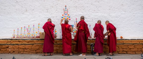 Young monks painting at a monastery in Thimphu – cultural and spiritual moment in Bhutan.