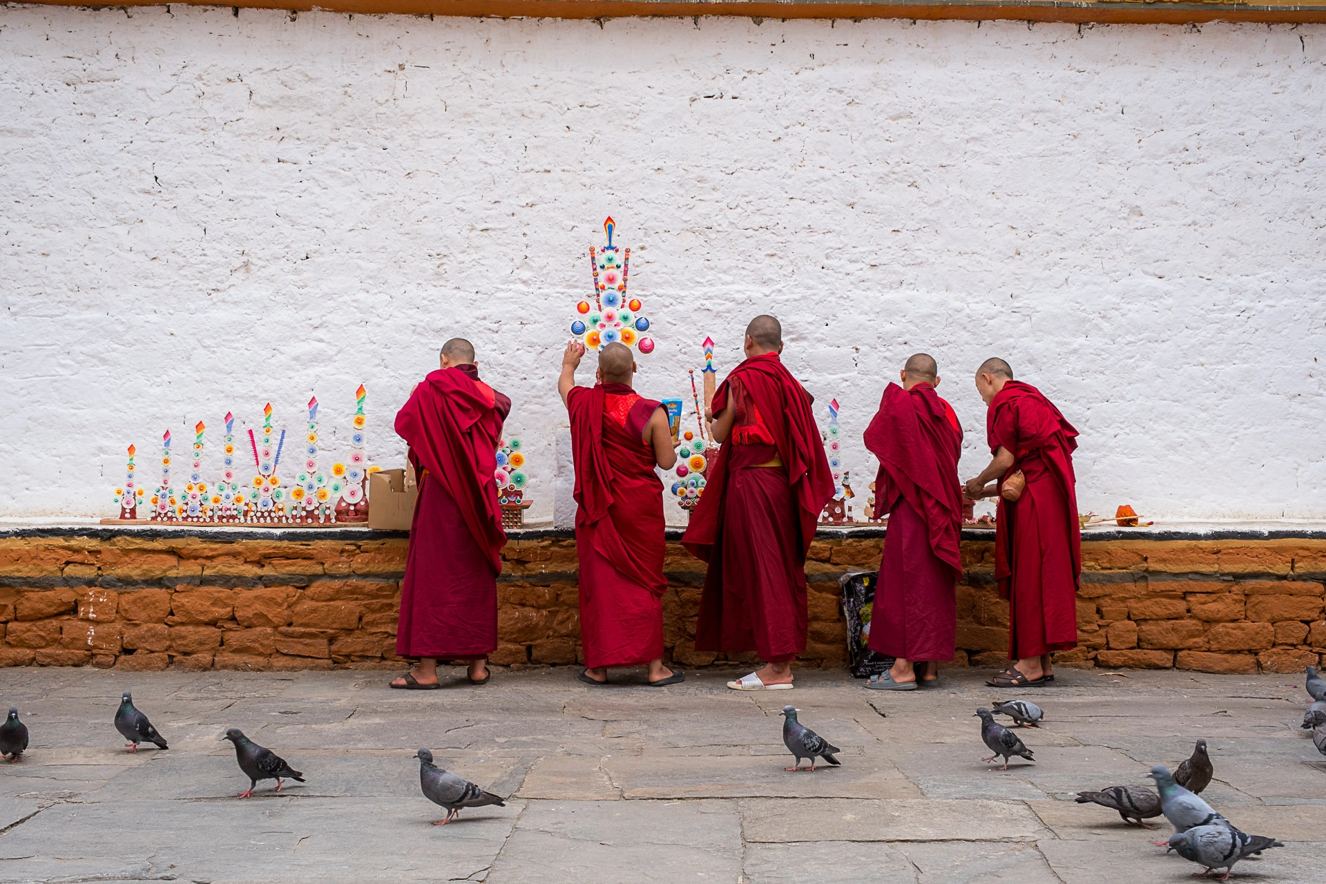 Young monks painting at a monastery in Thimphu – cultural and spiritual moment in Bhutan.