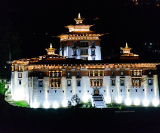 Paro Dzong fortress monastery overlooking Paro Valley on Bhutan Tour 3 Nights 4 Days.