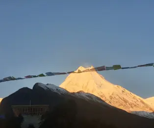 Golden glow on Mount Manaslu during the Manaslu Circuit Trek from Pokhara.