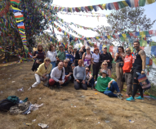 Kamal Dhodari, expert cultural tour guide in Nepal, with group during guided tour.