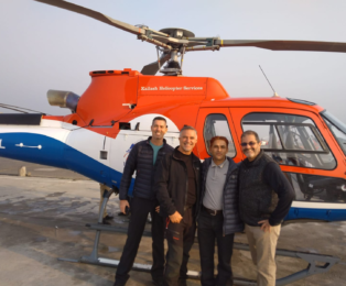 Kamal Dhodari with group during Everest helicopter tour experience in Nepal.
