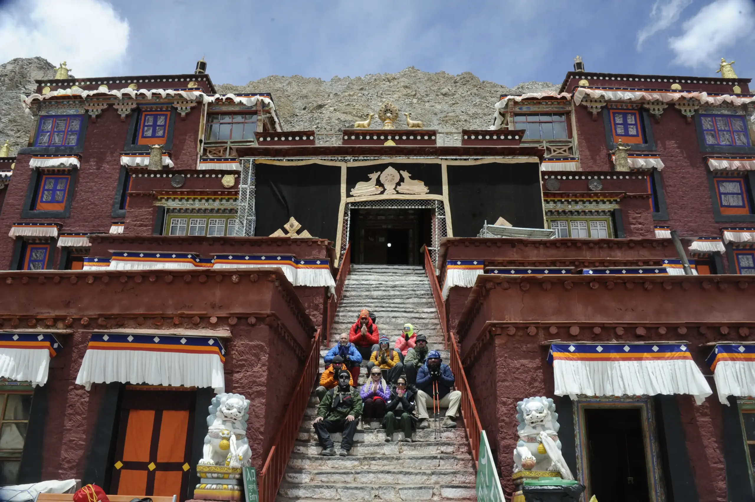 Pilgrims sitting on the staircase of Diraphuk Monastery during the Kailash Mansarovar Yatra