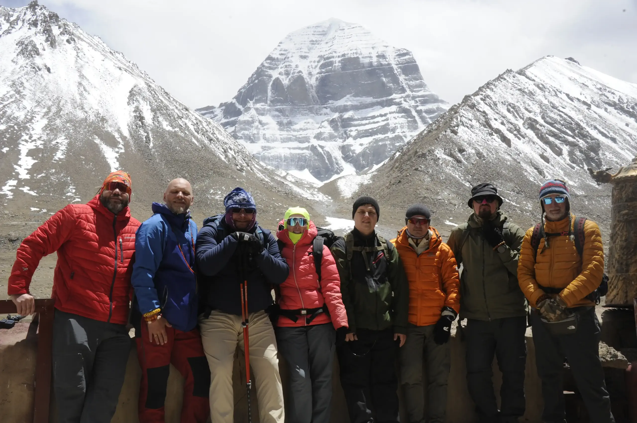 Pilgrims resting near Diraphuk with the north face of Mount Kailash during the Kailash Kora trek