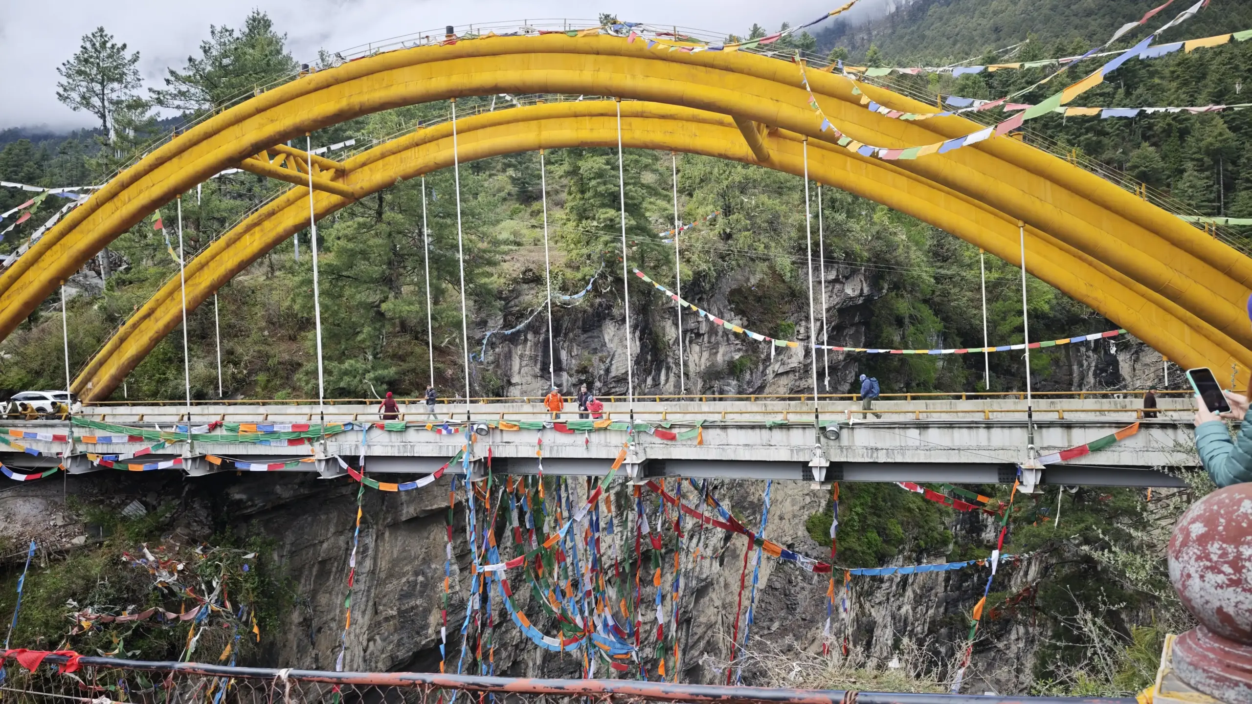 Decorated suspension bridge with Tibetan prayer flags during Kailash Mansarovar Yatra 2026