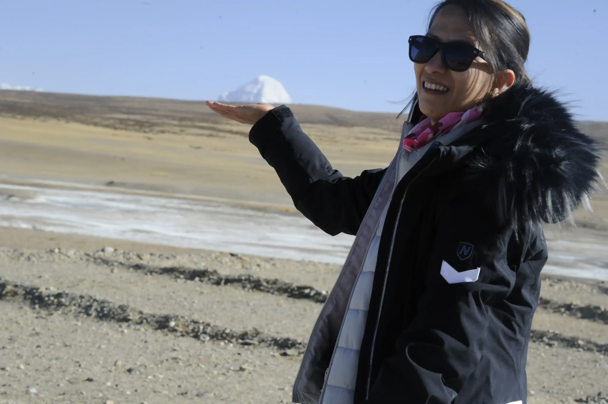 Pilgrim posing with Mount Kailash in the background during the Kailash Mansarovar Yatra