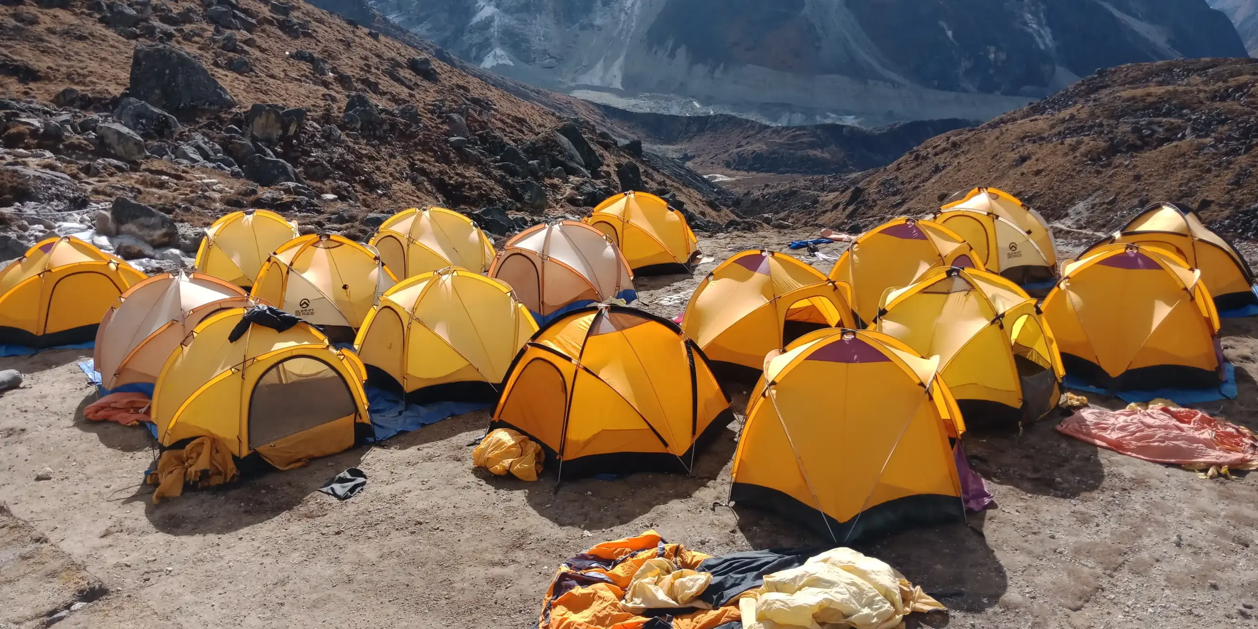 A vibrant tented camp nestled among the mountains, serving as a key stop on the journey to Mera Peak.