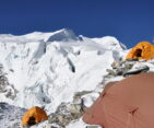Mera Peak High Camp tents overlooking snow-covered Himalayan mountains during a climbing expedition in Nepal