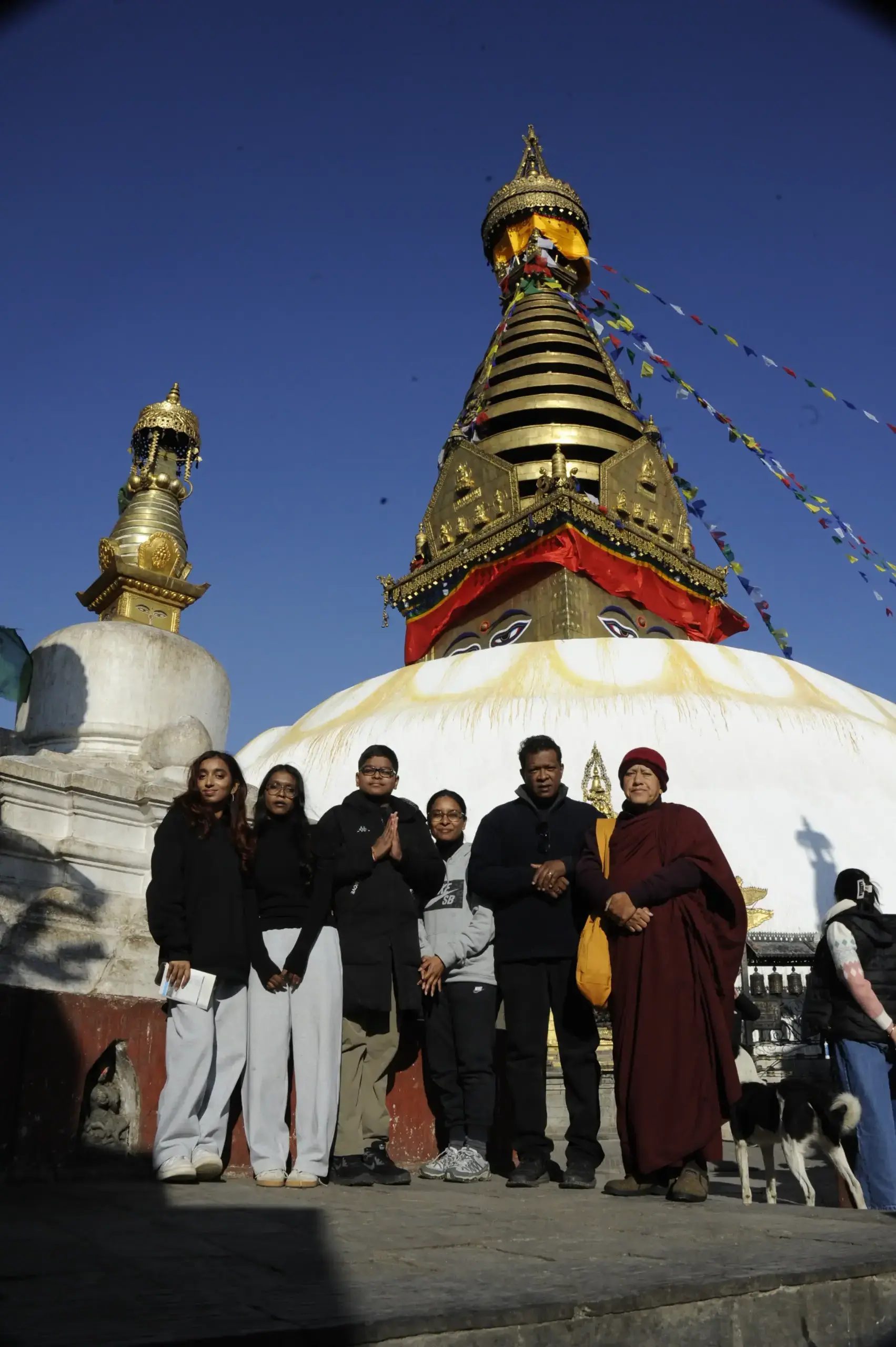 Our guests meeting a Buddhist monk for a special Puja at Swayambhunath Mahachaitya during the Best of Nepal Tour.