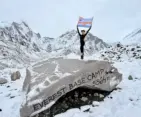 Solo female trekker celebrating at Everest Base Camp at 5,364 meters during the Everest Base Camp Trek 2026, surrounded by snow-covered Himalayan peaks.